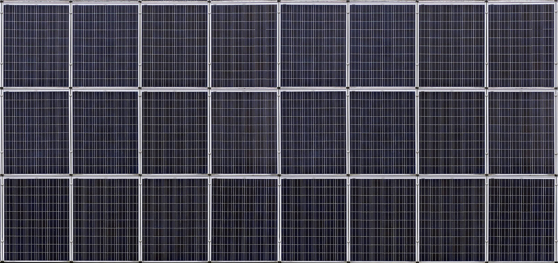 Homeowner reading about solar panel frequently asked questions on a tablet