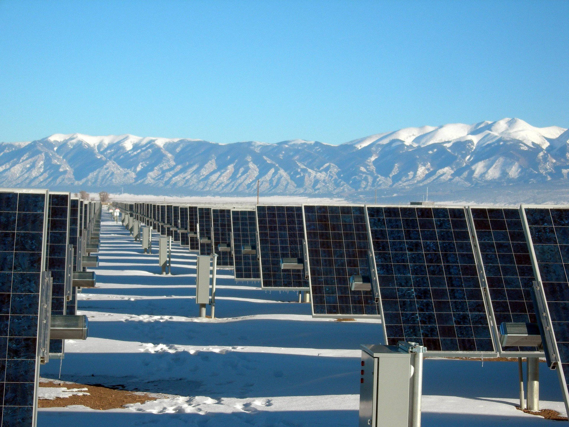 A solar installer surveying a roof before providing a quote